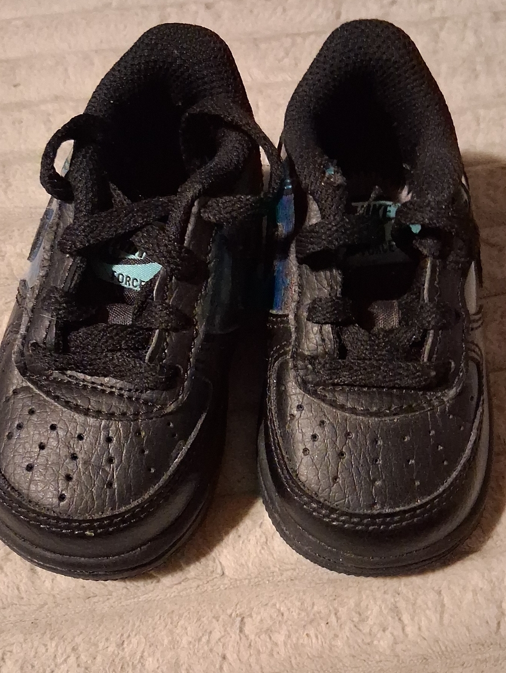 Nike Kids Black Sneakers with Blue Accents